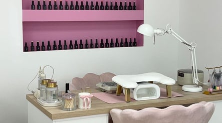 Stylish nail station at Anna Rae Beauty, Paisley, Scotland, GB, showcasing manicure tools and polish display.