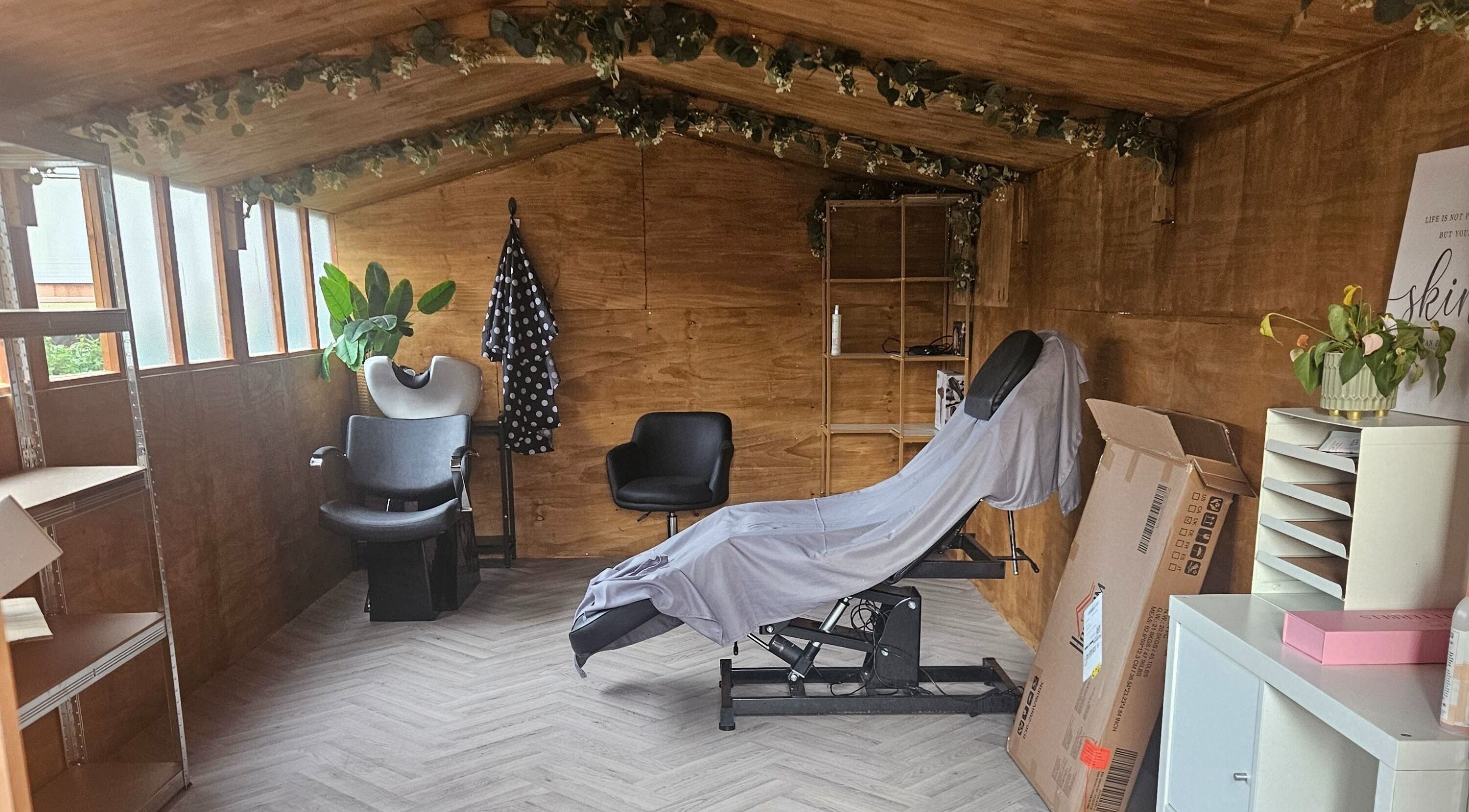 Cozy interior of Moon Rose Hair & Beauty in Thurlton, England. Features a stylist chair and wooden decor.