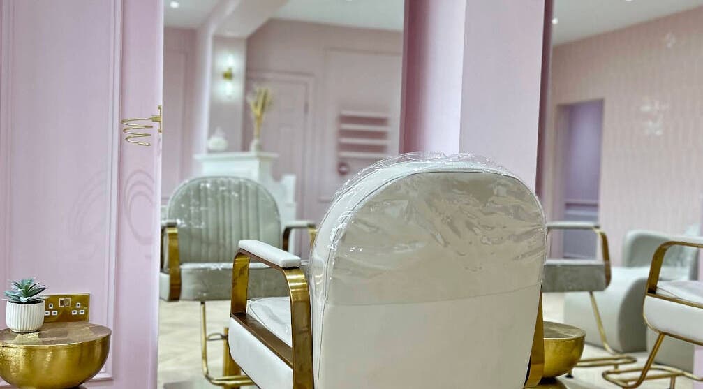 Luxurious salon interior at Styleddbyesme, Eccles, England, GB with chic decor and elegant seating.