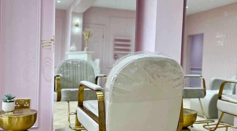 Luxurious salon interior at Styleddbyesme, Eccles, England, GB with chic decor and elegant seating.