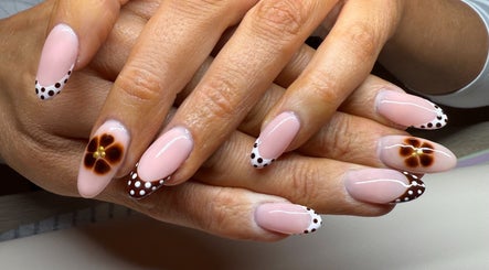 Artistic nail design with floral and polka dot patterns at Gels By Bethan, Marske-by-the-sea, England, GB.