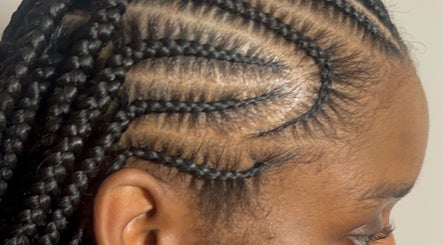 Close-up of intricate braided hairstyle by DoneByDeonne in Bronx, NY, US.