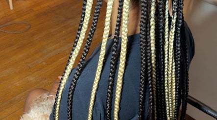 Intricate black and blonde braids at DoneByDeonne, Bronx, NY, US, showcasing expert hair styling.