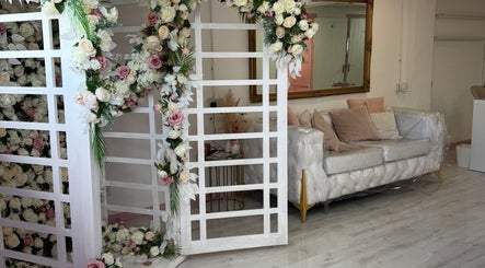 Elegant floral decor and chic seating at Nails by Miki, Wilnecote, England, GB exude a welcoming atmosphere.