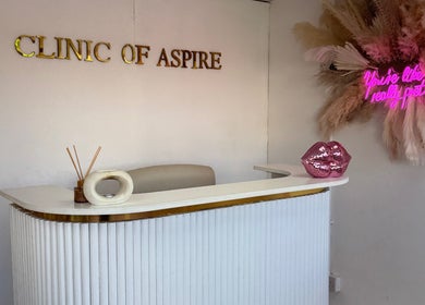 Reception area at Nails by Miki in Wilnecote, England, GB with elegant decor and neon quote.