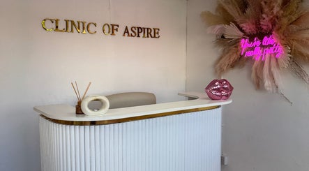 Reception area at Nails by Miki in Wilnecote, England, GB with elegant decor and neon quote.