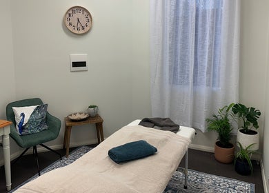 Relaxing therapy room at Gaia Holistic Therapies in Wagga Wagga, New South Wales, AU with massage table and decor.