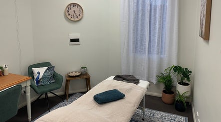 Relaxing therapy room at Gaia Holistic Therapies in Wagga Wagga, New South Wales, AU with massage table and decor.