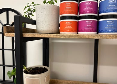 Stylish shelf at Gaia Holistic Therapies, Wagga Wagga, NSW, with plants and wellness products.