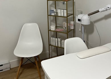 GSkinStudio treatment area in Dieppe, New Brunswick, CA with modern furniture and skincare products.