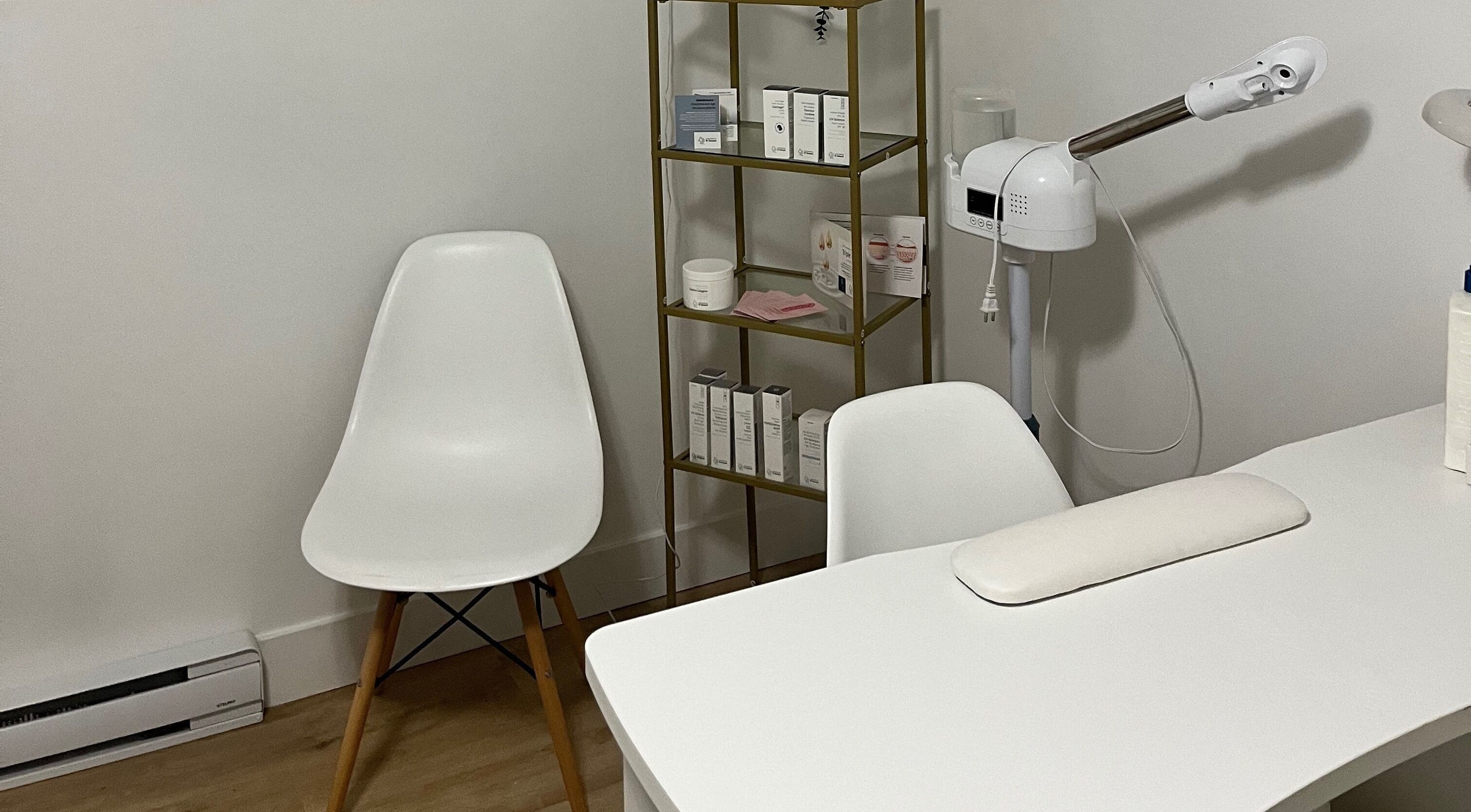 GSkinStudio treatment area in Dieppe, New Brunswick, CA with modern furniture and skincare products.