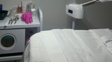 Clean beauty spa room at GSkinStudio, Dieppe, New Brunswick, CA with tools and pink gloves on a counter.