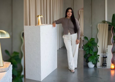 Modern interior of AV BEAUTY STUDIO in Melbourne, Victoria, AU with a smiling staff member near reception.