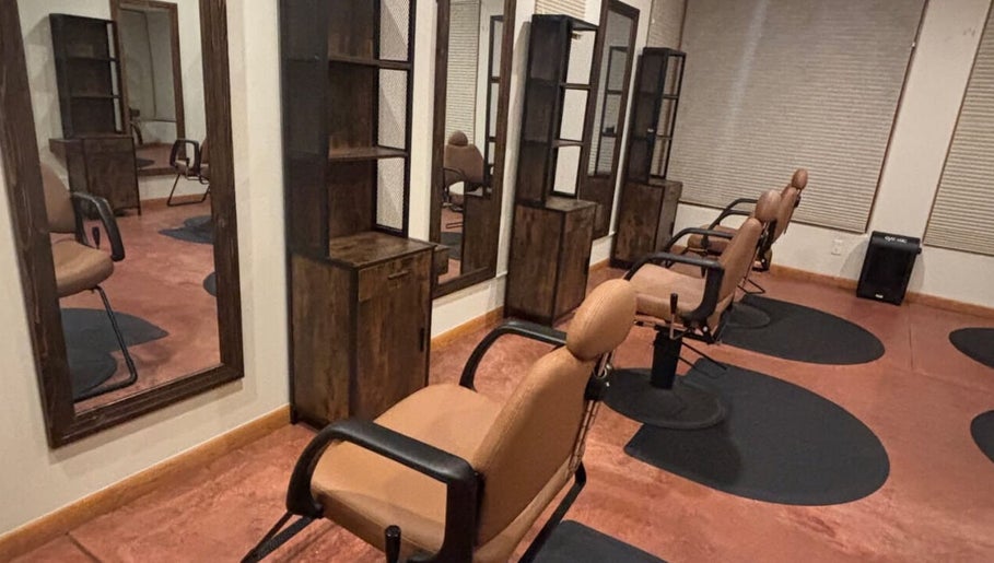 Elegant salon interior at Nova beauty boutique by Carla Torres, Santa Fe, New Mexico, US. Modern styling chairs and mirrors.