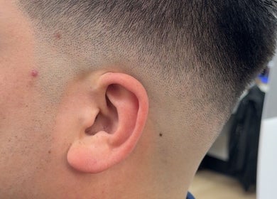 Close-up of precision fade haircut at Nova beauty boutique by Carla Torres, Santa Fe, New Mexico, US.