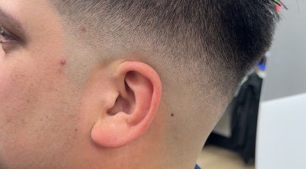 Close-up of precision fade haircut at Nova beauty boutique by Carla Torres, Santa Fe, New Mexico, US.