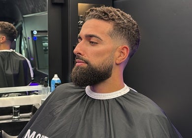 Stylish haircut at Montana Fades Mobile Barbershop, Dubai, Dubai, AE. Modern grooming in a sleek setting.