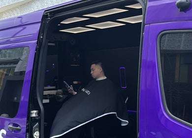 Client receiving haircut in Montana Fades Mobile Barbershop, Dubai, Dubai, AE, interior view.