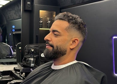 Client getting a haircut inside Montana Fades Mobile Barbershop located in Dubai, Dubai, AE.