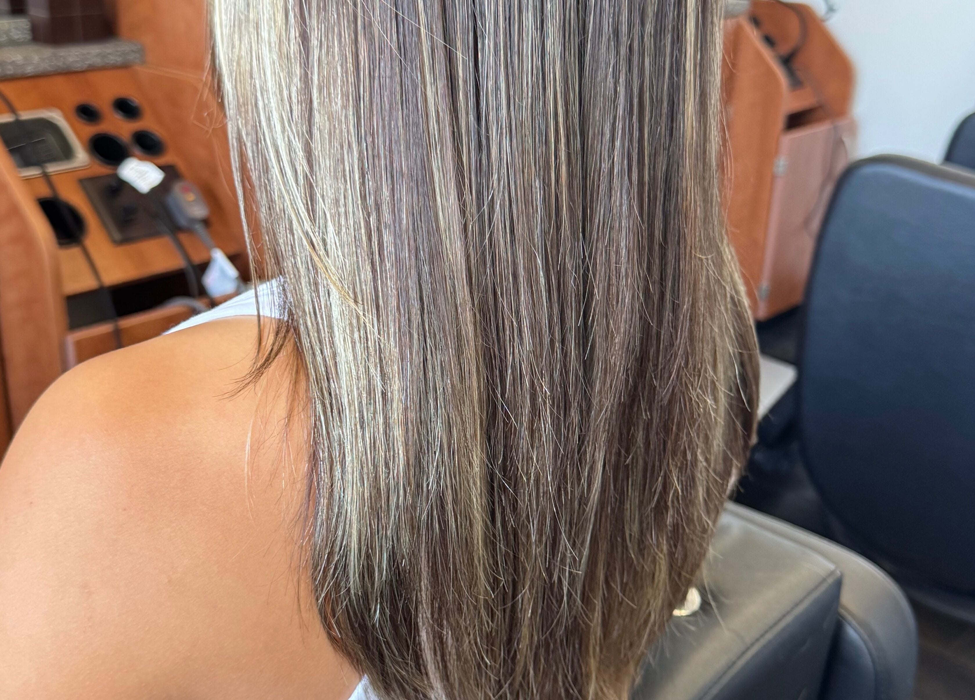 Highlighted long hair styled at Jing Zhou salon in San Mateo, California, US.