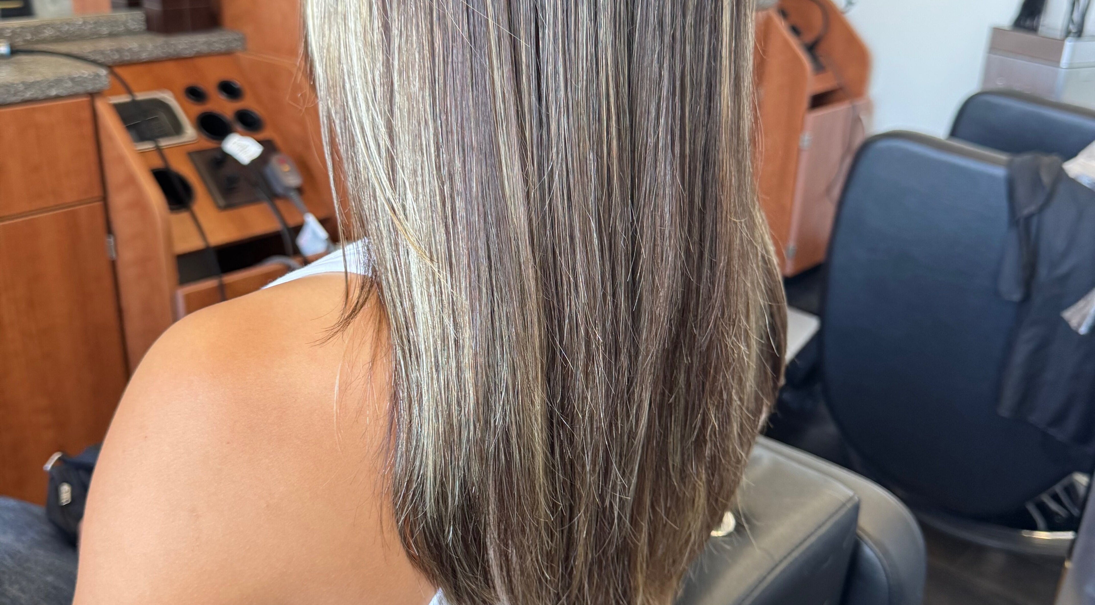 Highlighted long hair styled at Jing Zhou salon in San Mateo, California, US.