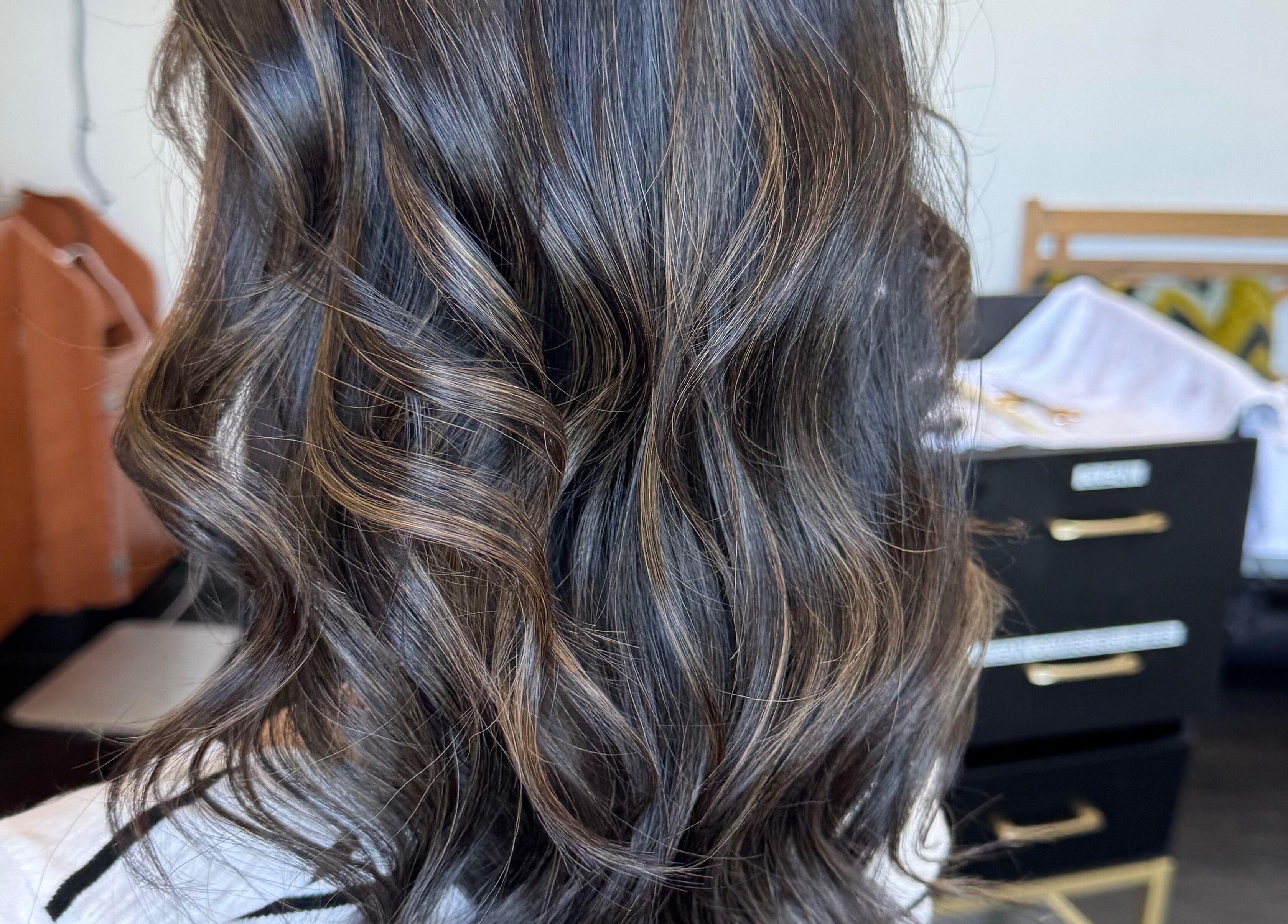 Stylish wavy hairstyle at Jing Zhou salon, San Mateo, California, US.