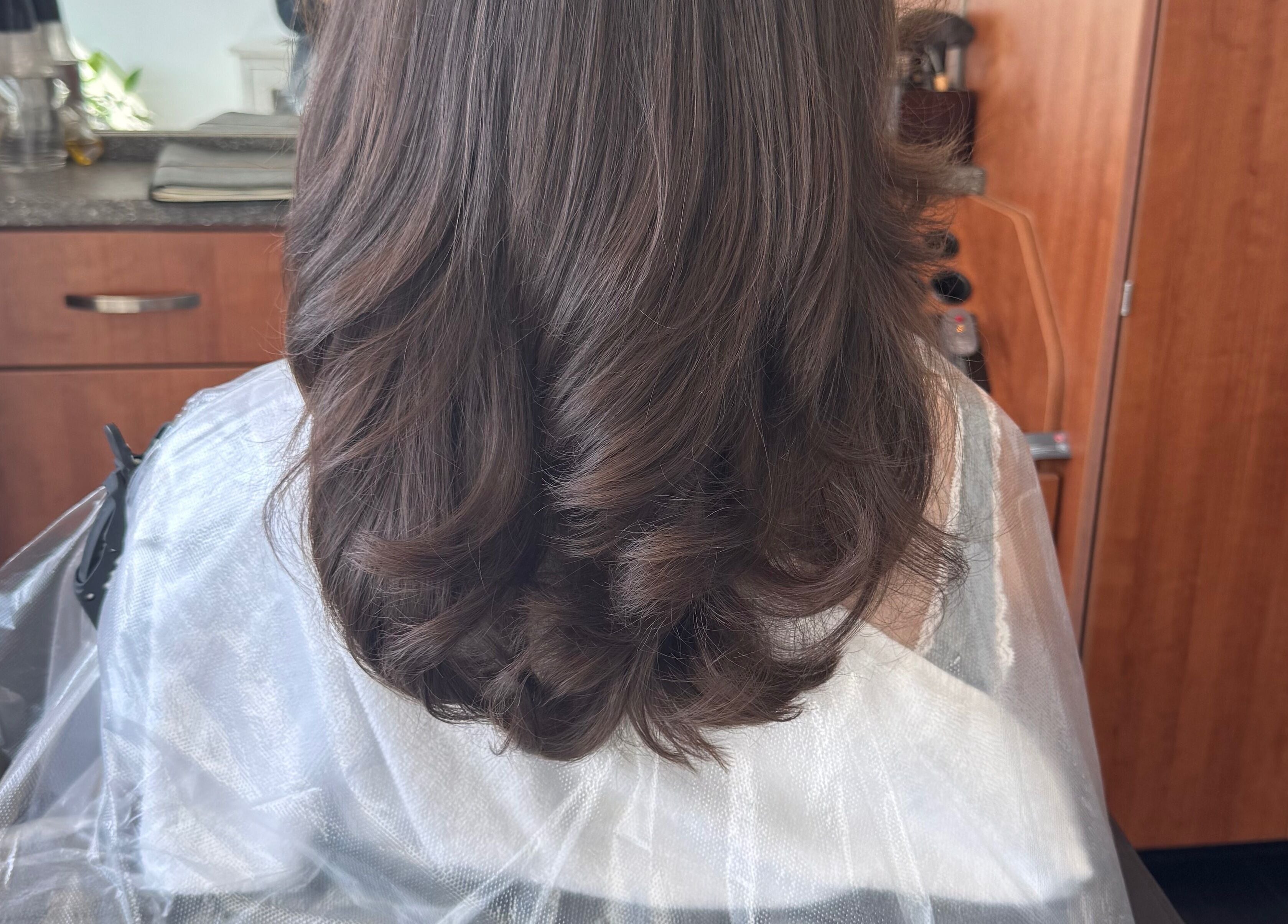 Beautiful hairstyle with soft curls at Jing Zhou salon, San Mateo, California, US.