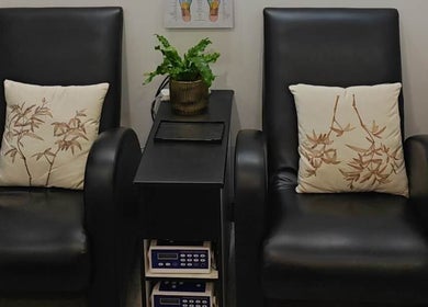 Relaxing lounge area at Her3 Day Spa Massage & Acupuncture, Marrickville, New South Wales, AU featuring cozy chairs.