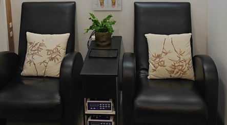 Relaxing lounge area at Her3 Day Spa Massage & Acupuncture, Marrickville, New South Wales, AU featuring cozy chairs.