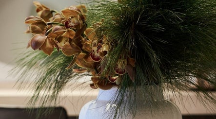 Elegant orchid and greenery arrangement at Clipso Hair, Castlecrag, New South Wales, AU.