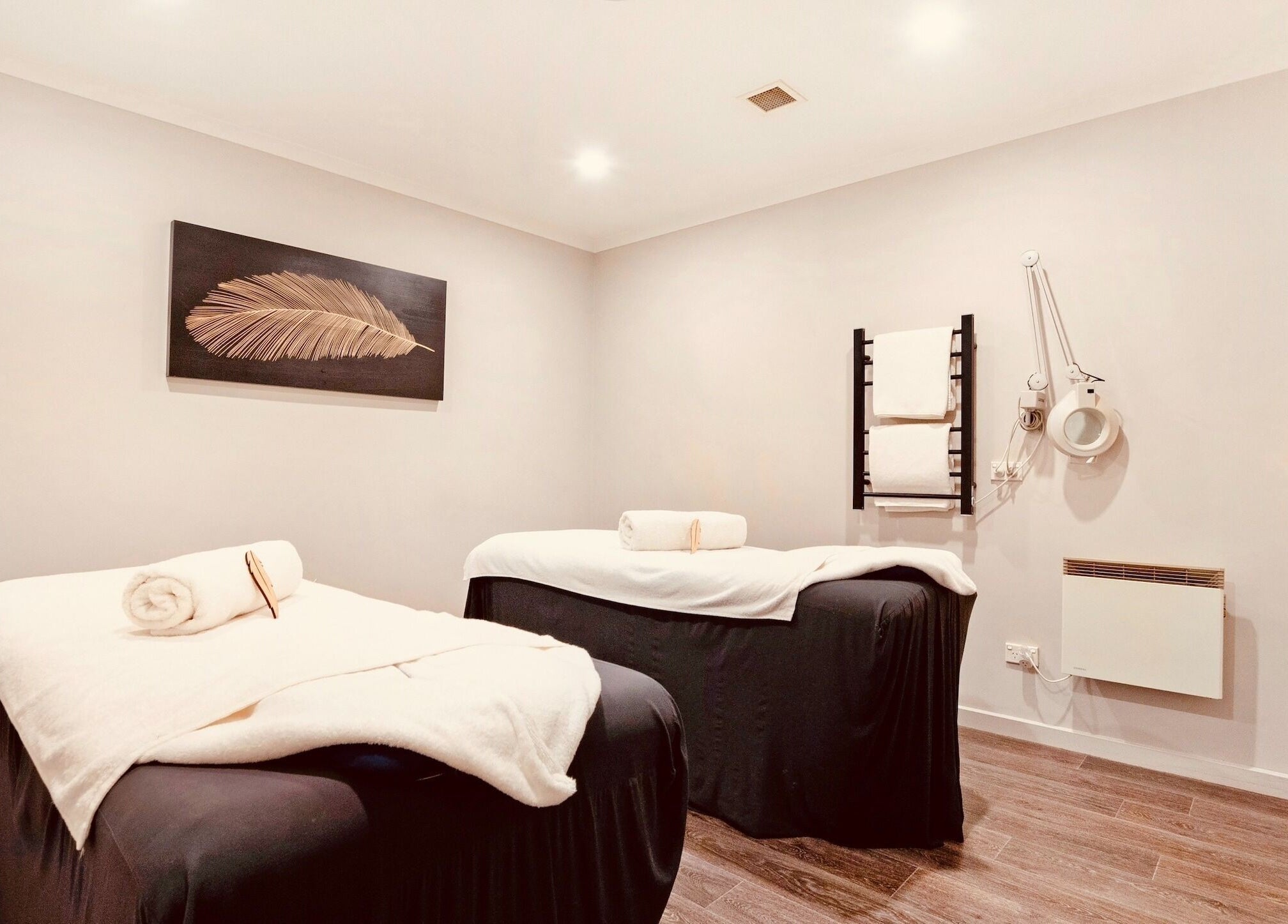 Tranquil treatment room at Port Fairy Day Spa in Port Fairy, Victoria, AU, featuring two massage tables.