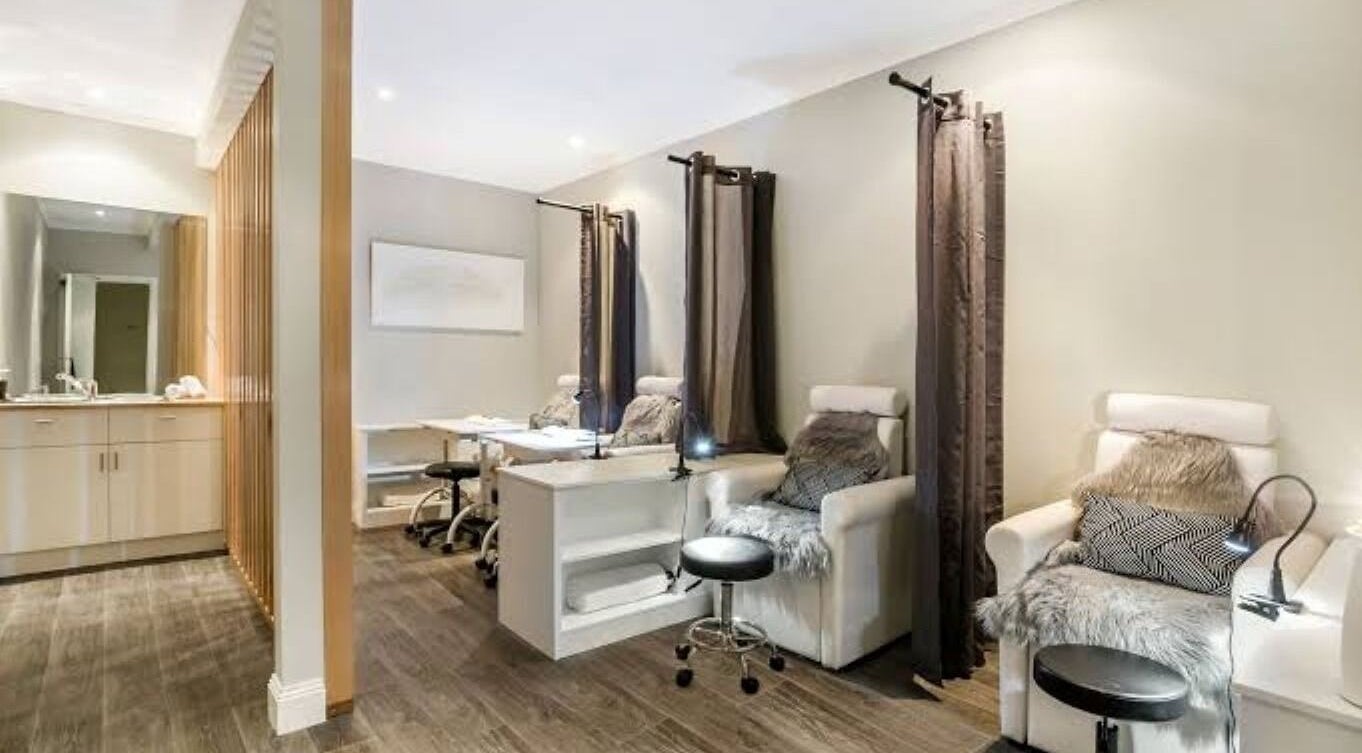 Relaxing spa lounge at Port Fairy Day Spa, Port Fairy, Victoria, AU with plush seating and wooden floor.