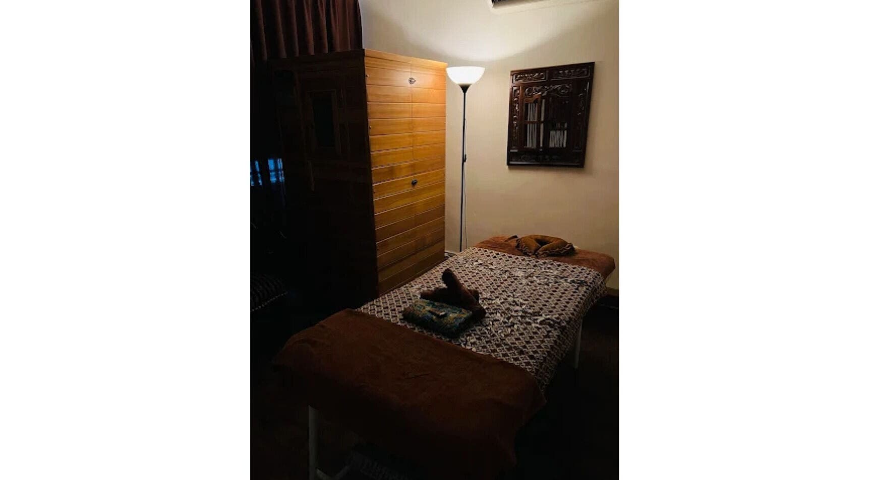 Cozy treatment room at Akma Spa, Semenyih, Selangor, MY with massage bed and ambient lighting.
