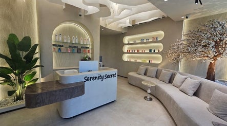 Reception area at Serenity Secret Beauty Salon and Spa in Dubai, AE, with elegant decor and a cozy seating area.