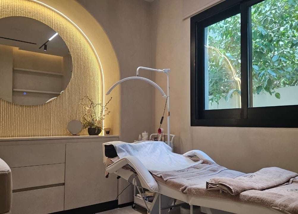 Relaxing treatment room at Serenity Secret Beauty Salon and Spa, Dubai, AE, with elegant decor and soothing ambiance.