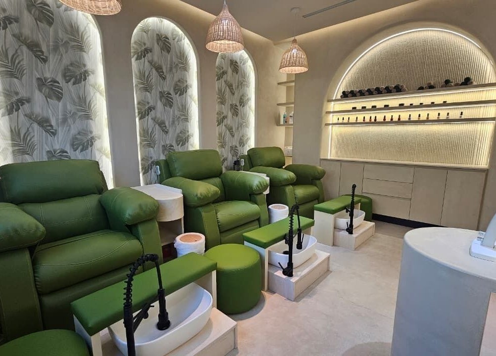 Serenity Secret Beauty Salon and Spa pedicure chairs, green seating for relaxation in Dubai, AE.