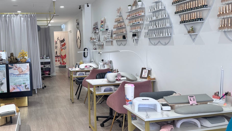 Interior view of Luna Nails & Beauty, Southport, Queensland, AU, featuring elegant manicure stations and nail polish displays.