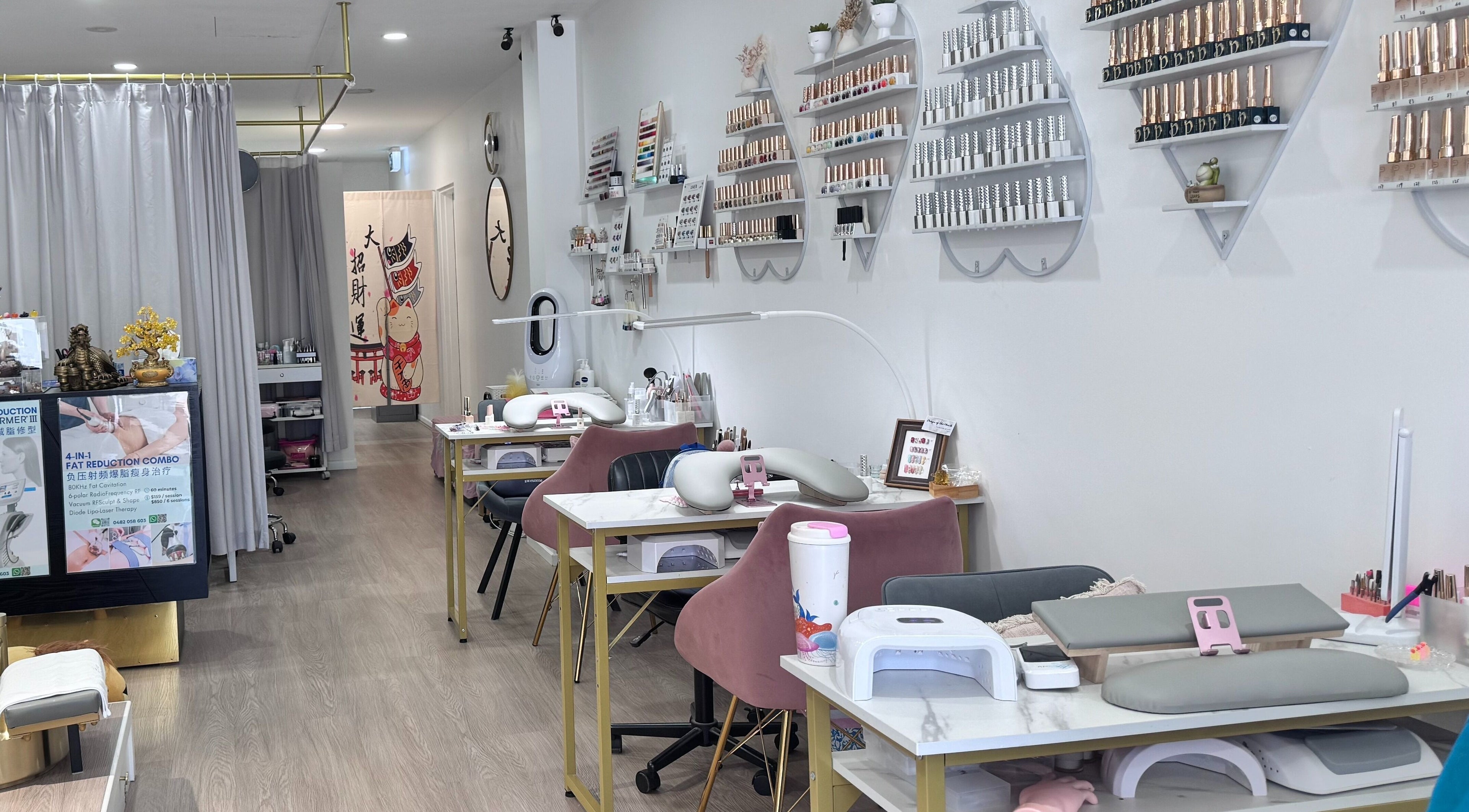 Interior view of Luna Nails & Beauty, Southport, Queensland, AU, featuring elegant manicure stations and nail polish displays.