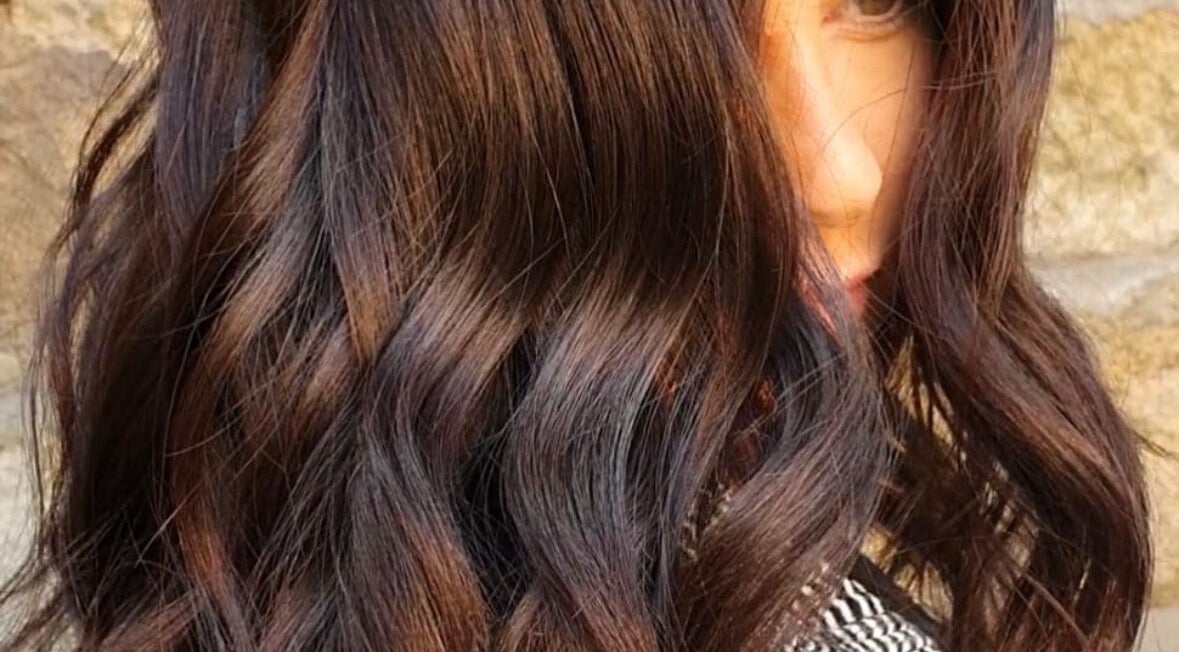 Rich brunette waves styled at Hairbylianne in Leeds, England, GB, showcasing luxurious hair texture.