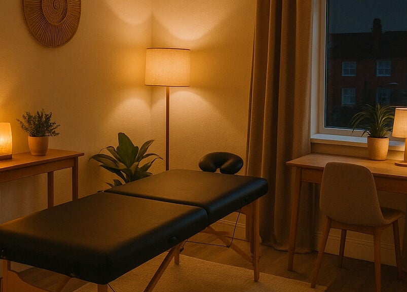A calming massage room at Massage by Michaela J in Normanton, England, GB, featuring warm lighting.