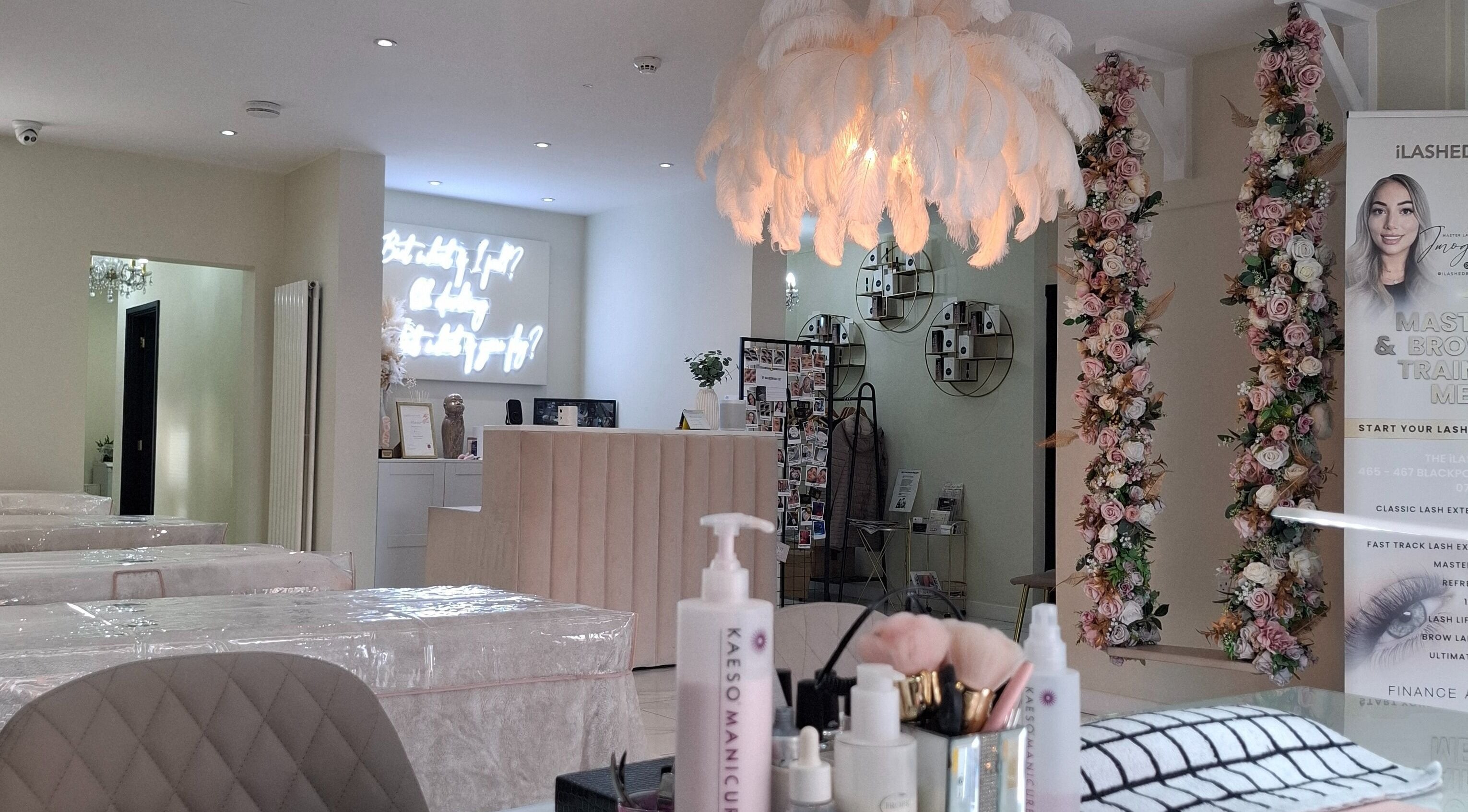 Elegant LKBeauty interior with floral decor in Preston, England, GB, highlighting modern wellness amenities.