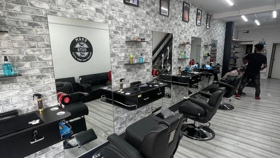 Modern salon interior at Braids by NicoleRose in Plymouth, England, GB, showcasing sleek styling stations.