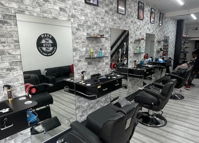 Modern salon interior at Braids by NicoleRose in Plymouth, England, GB, showcasing sleek styling stations.