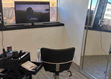 Stylish salon chair and mirror at Braids by NicoleRose in Plymouth, England, GB. A cozy beauty space.