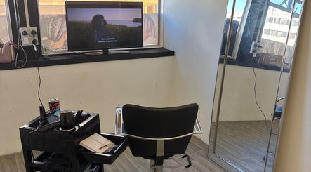 Stylish salon chair and mirror at Braids by NicoleRose in Plymouth, England, GB. A cozy beauty space.