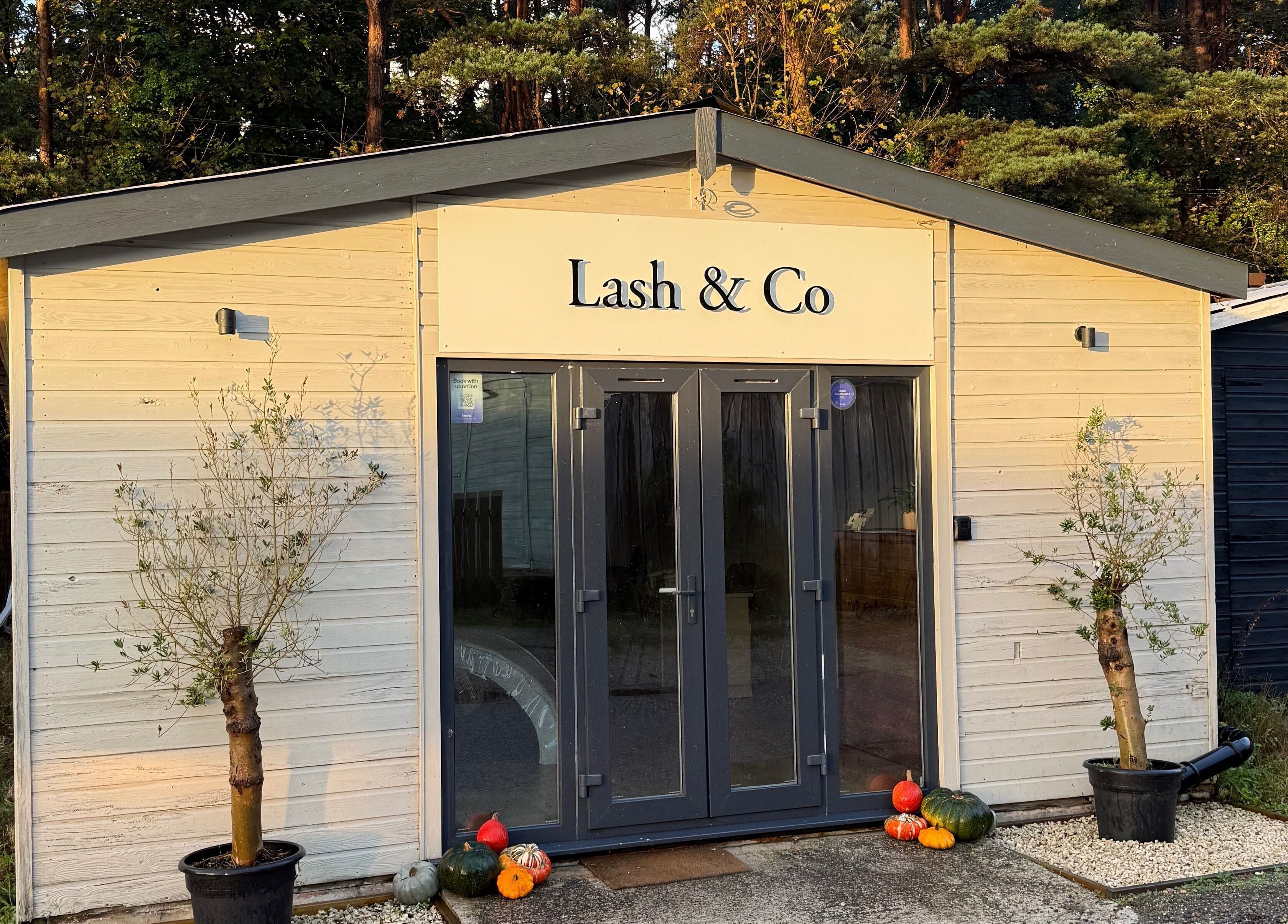 Front view of Soluna in Par, England, GB with inviting entrance and potted plants.