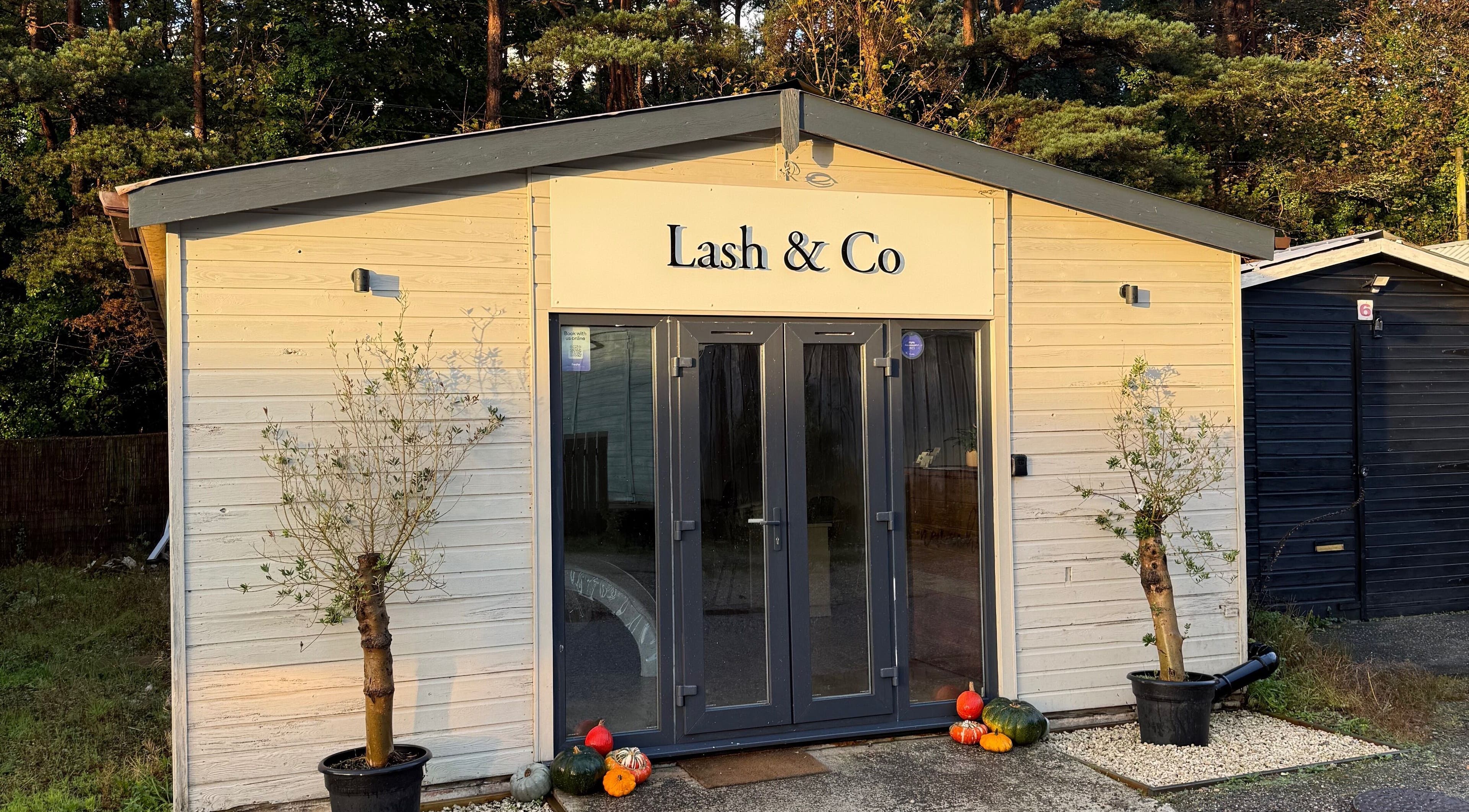 Front view of Soluna in Par, England, GB with inviting entrance and potted plants.