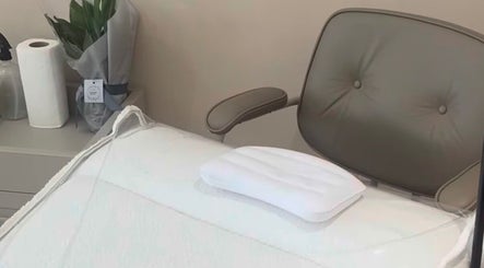 Relaxing treatment area at Soluna, Par, England, GB with plush chair and serene decor.
