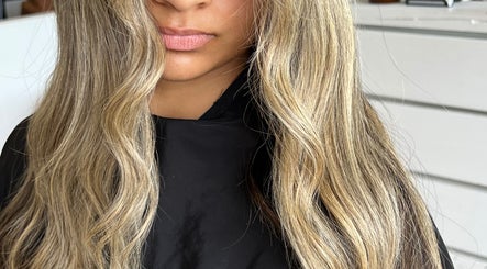 Styled blonde hair waves at Aloha Hair & co, Varsity Lakes, Queensland, AU, showcasing salon expertise.