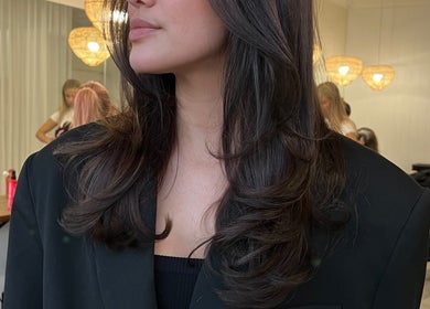 Elegant hairstyle at Aloha Hair & co, Varsity Lakes, Queensland, AU, with stylish curls.